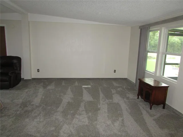 a view of a hallway with a chandelier