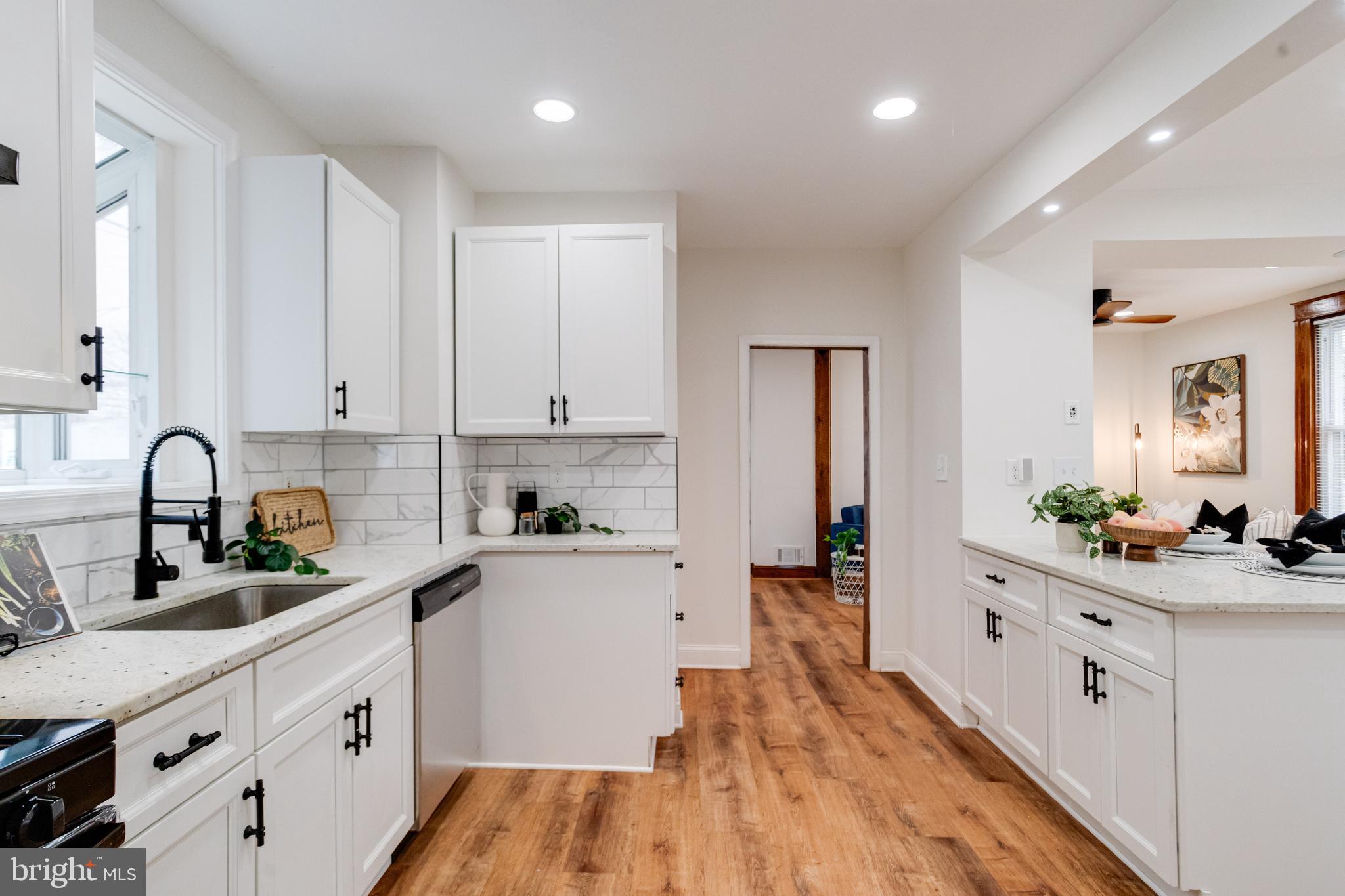 7932 Philadelphia Road Baltimore, MD 21237 - Photo 15 of 44 a kitchen with white cabinets and sink