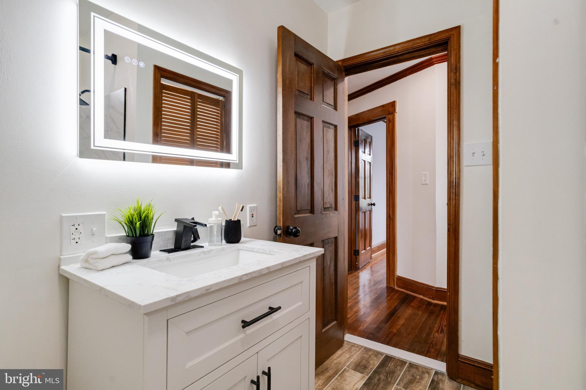 7932 Philadelphia Road Baltimore, MD 21237 - Photo 28 of 44 a bathroom with a sink and a mirror