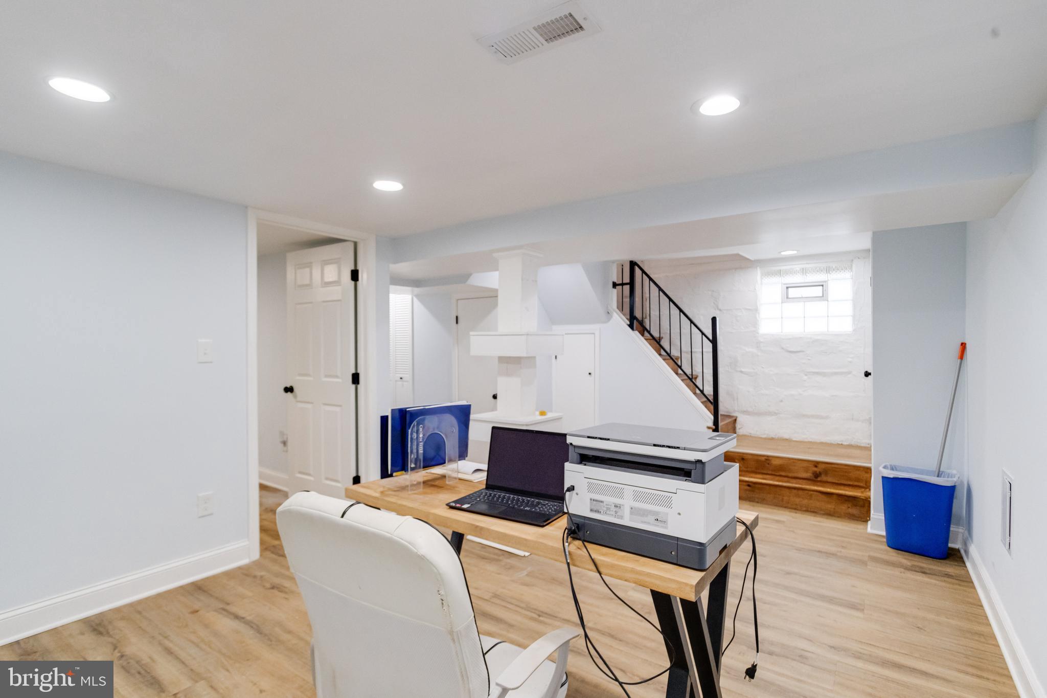 7932 Philadelphia Road Baltimore, MD 21237 - Photo 32 of 44 a living room with furniture and a wooden floor