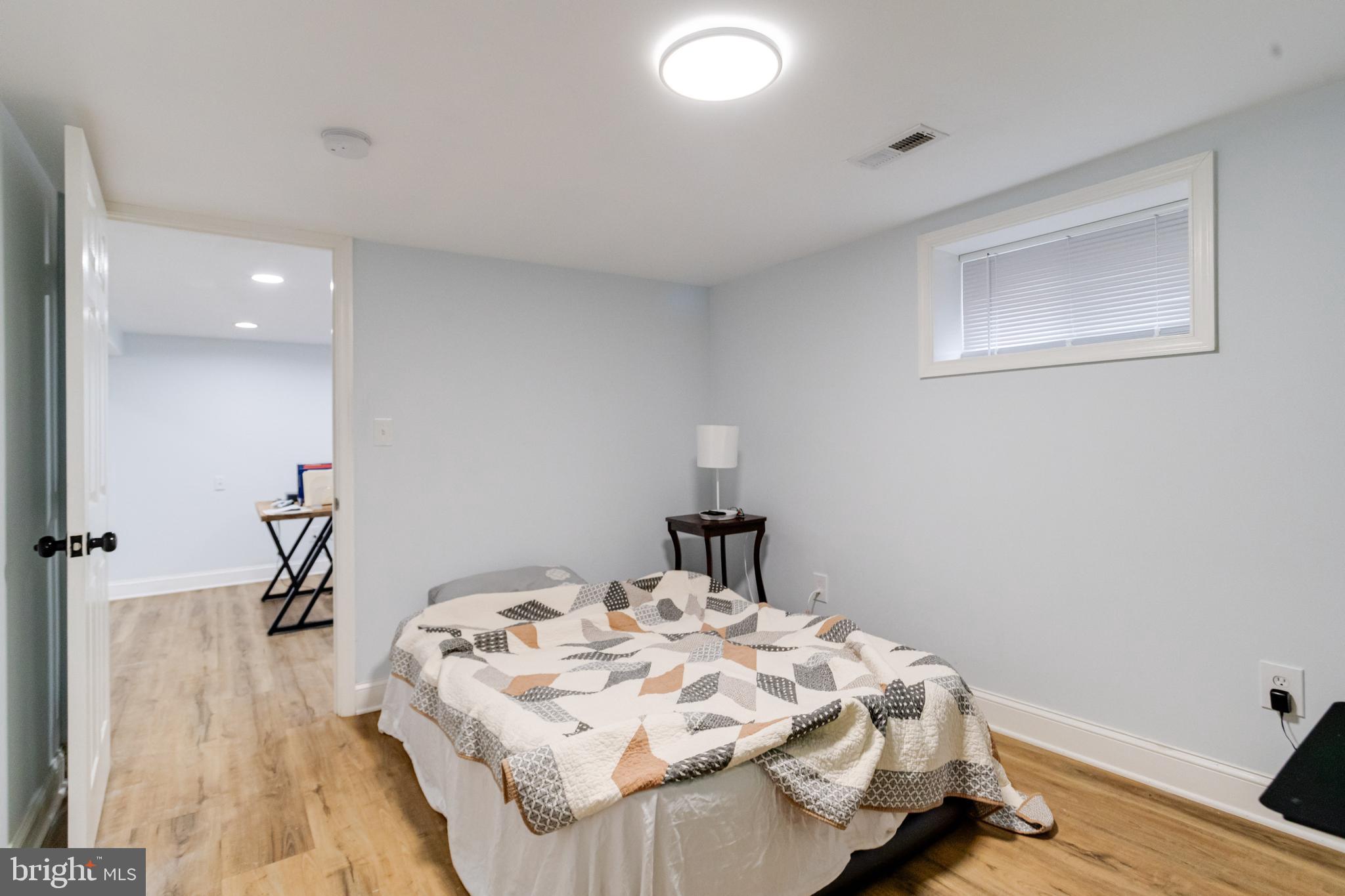 7932 Philadelphia Road Baltimore, MD 21237 - Photo 34 of 44 a bedroom with a bed and a desk