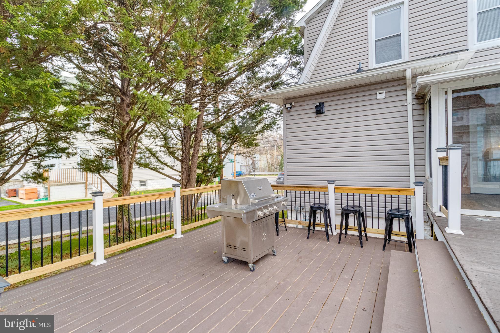 7932 Philadelphia Road Baltimore, MD 21237 - Photo 39 of 44 a view of a chairs and table on the wooden deck