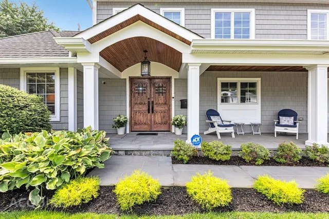 a front view of house with outdoor space and seating area