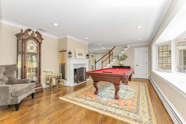a room with lots of furniture and wooden floor