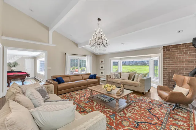 a living room with furniture or couch and a large window