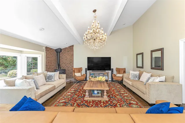 a living room with furniture rug and window