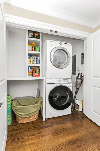 a living room with a couch and a wooden floor
