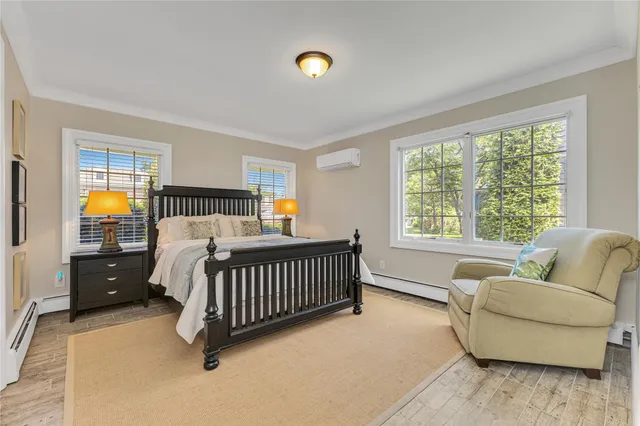 a bedroom with furniture and a window