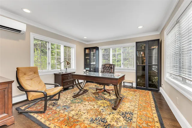 a view of a livingroom with furniture and a window