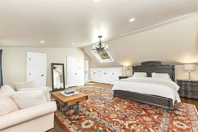 a bedroom with a bed and a couch