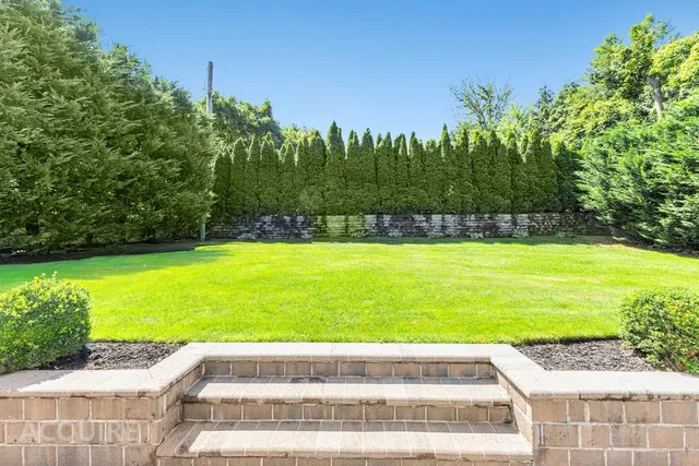 a view of swimming pool with a yard