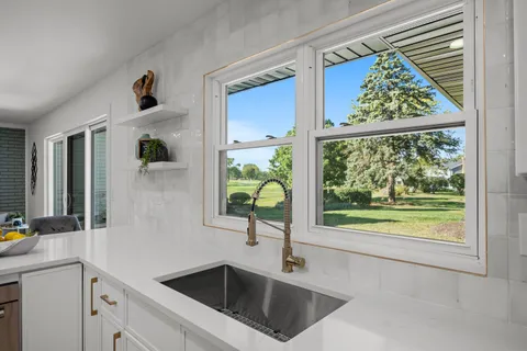 a kitchen with a sink and a window
