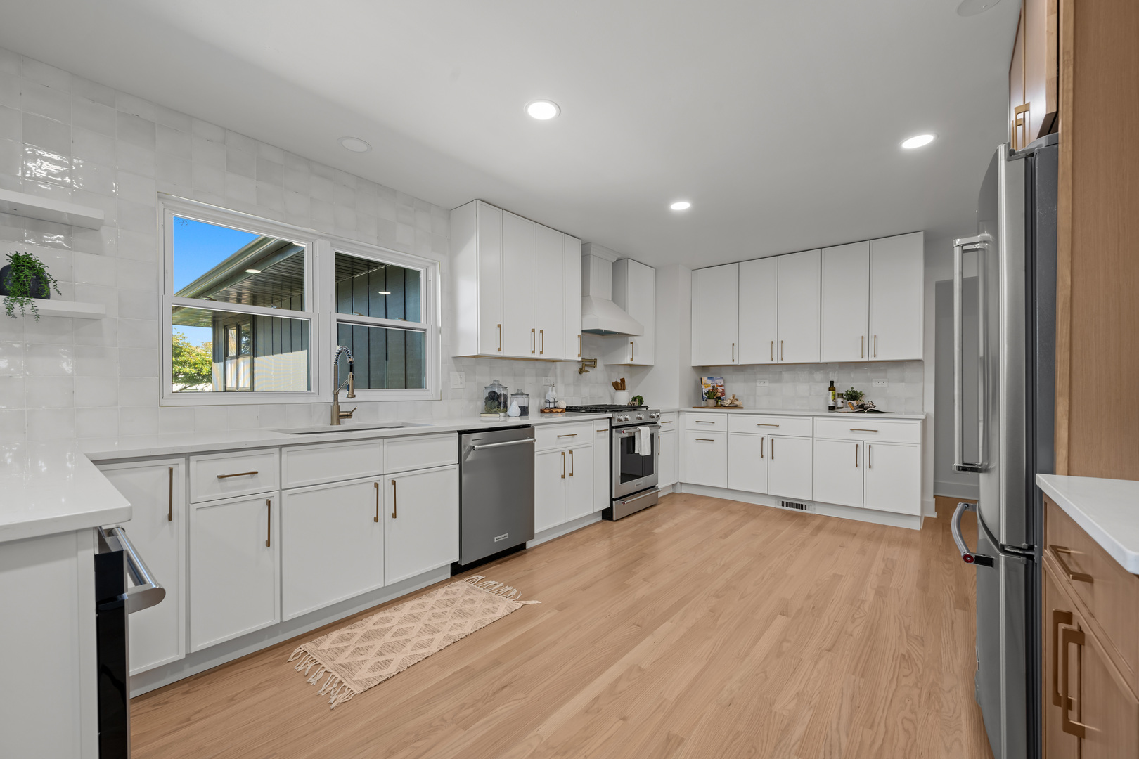 1405 West Street Naperville, IL 60563 - Photo 12 of 43 a kitchen with white cabinets and white appliances