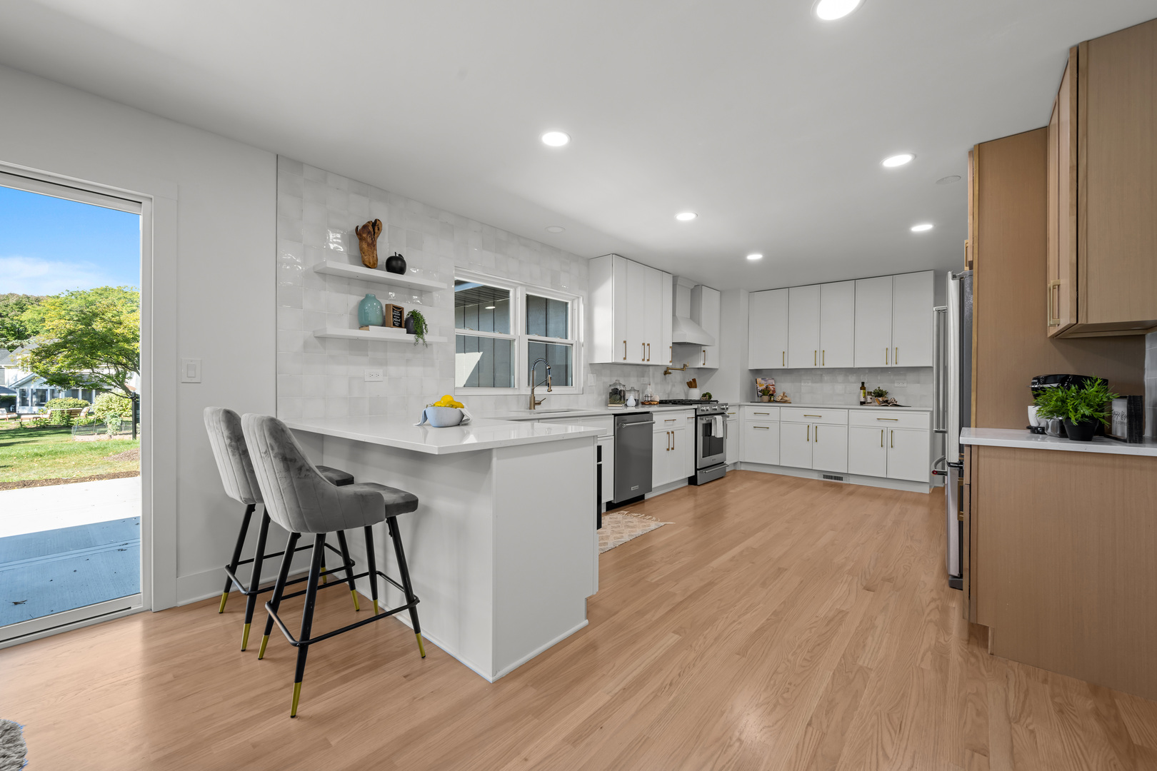 1405 West Street Naperville, IL 60563 - Photo 17 of 43 a kitchen with wooden floors and white appliances