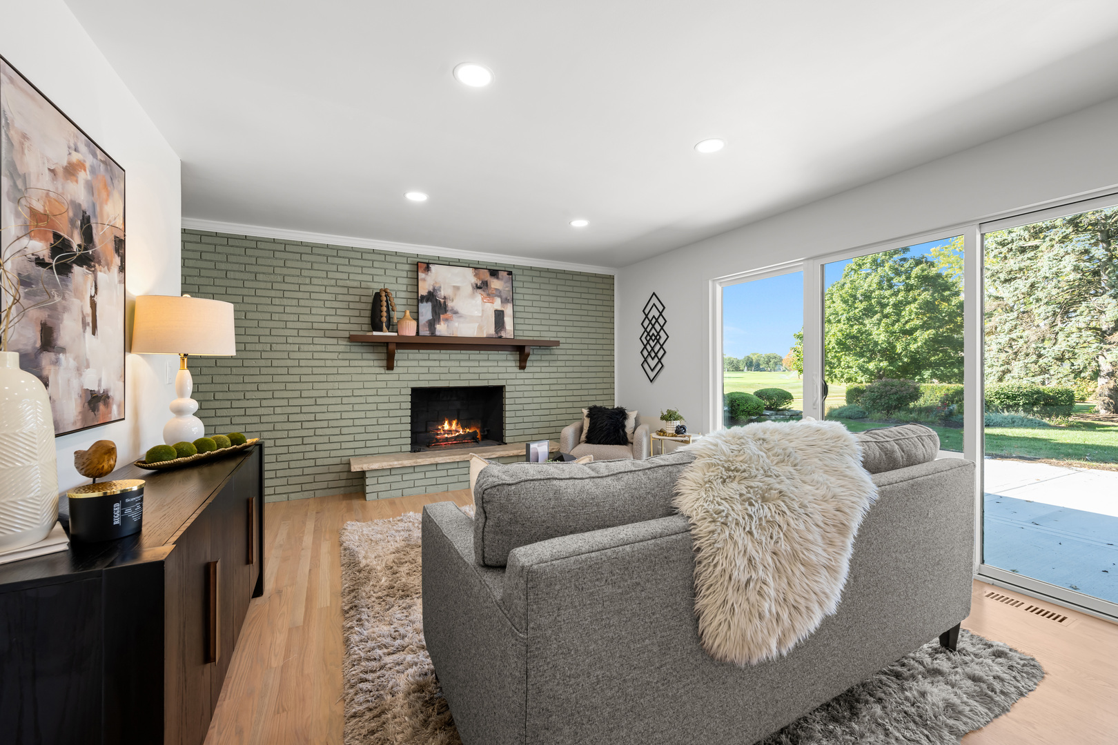 1405 West Street Naperville, IL 60563 - Photo 19 of 43 a living room with furniture a large window and a fireplace