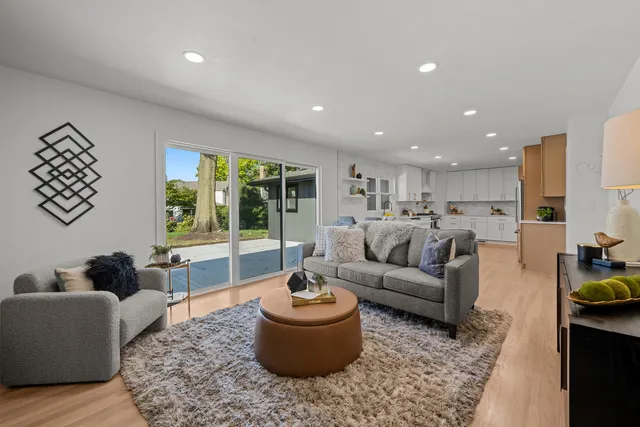 a living room with furniture and a large window