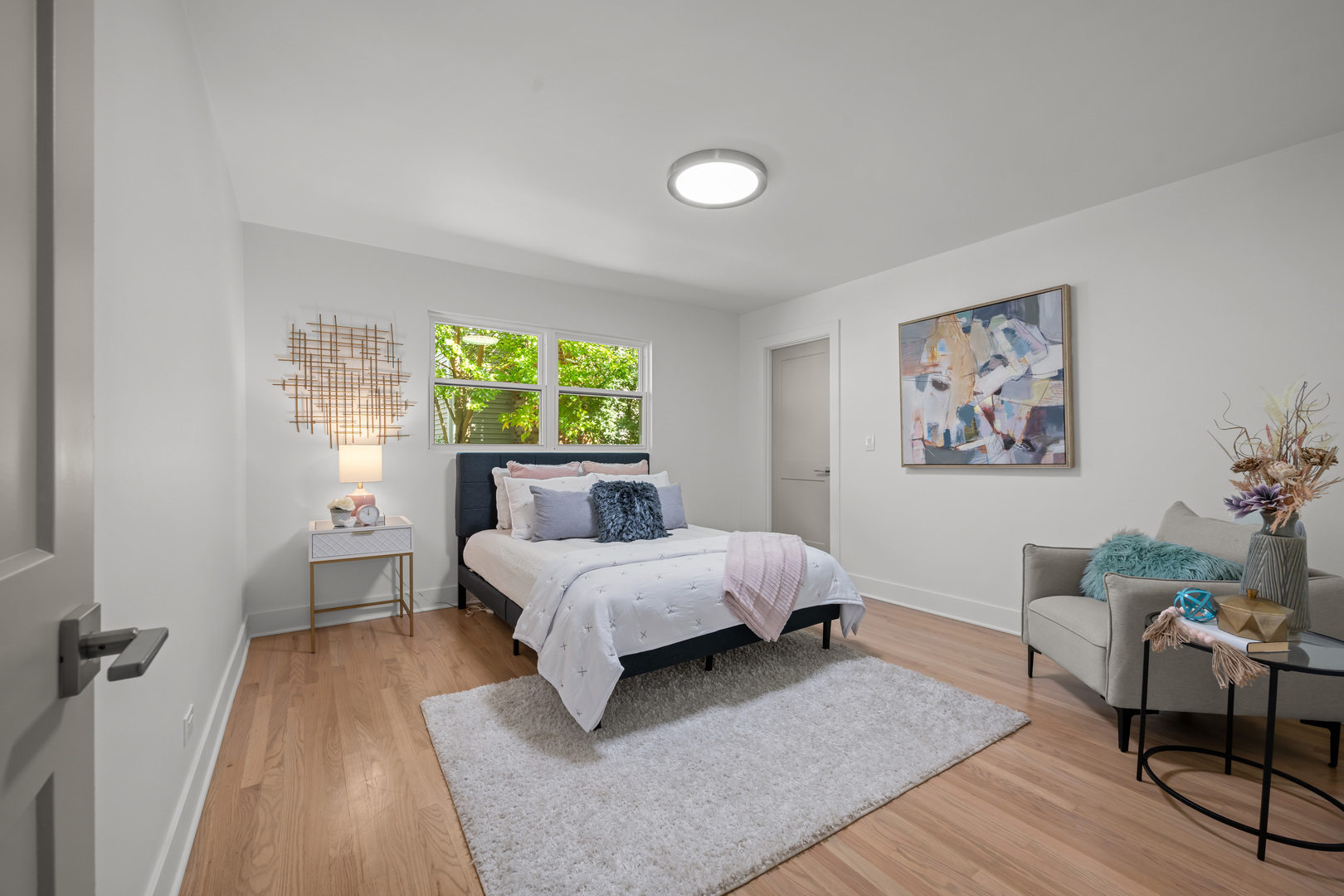 1405 West Street Naperville, IL 60563 - Photo 24 of 43 a bed room with a bed and a chair