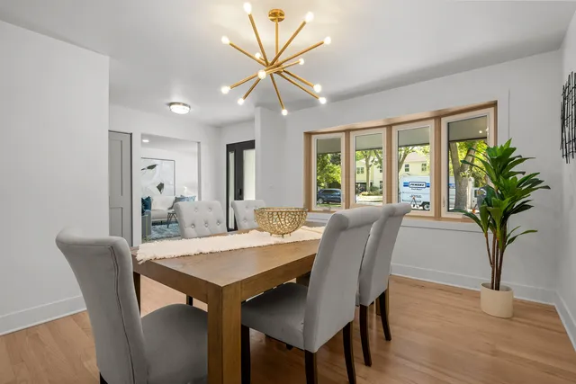 a view of a dining room with furniture window and wooden floor