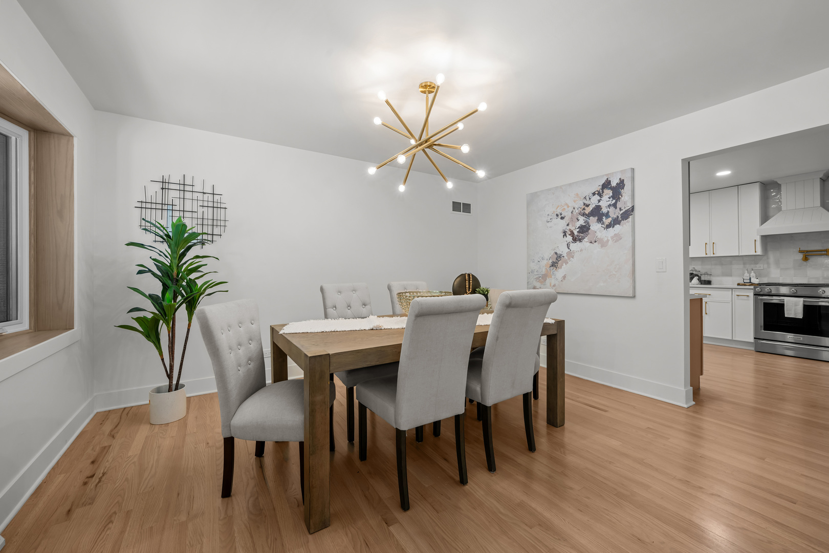 1405 West Street Naperville, IL 60563 - Photo 9 of 43 a view of a dining room with furniture and wooden floor