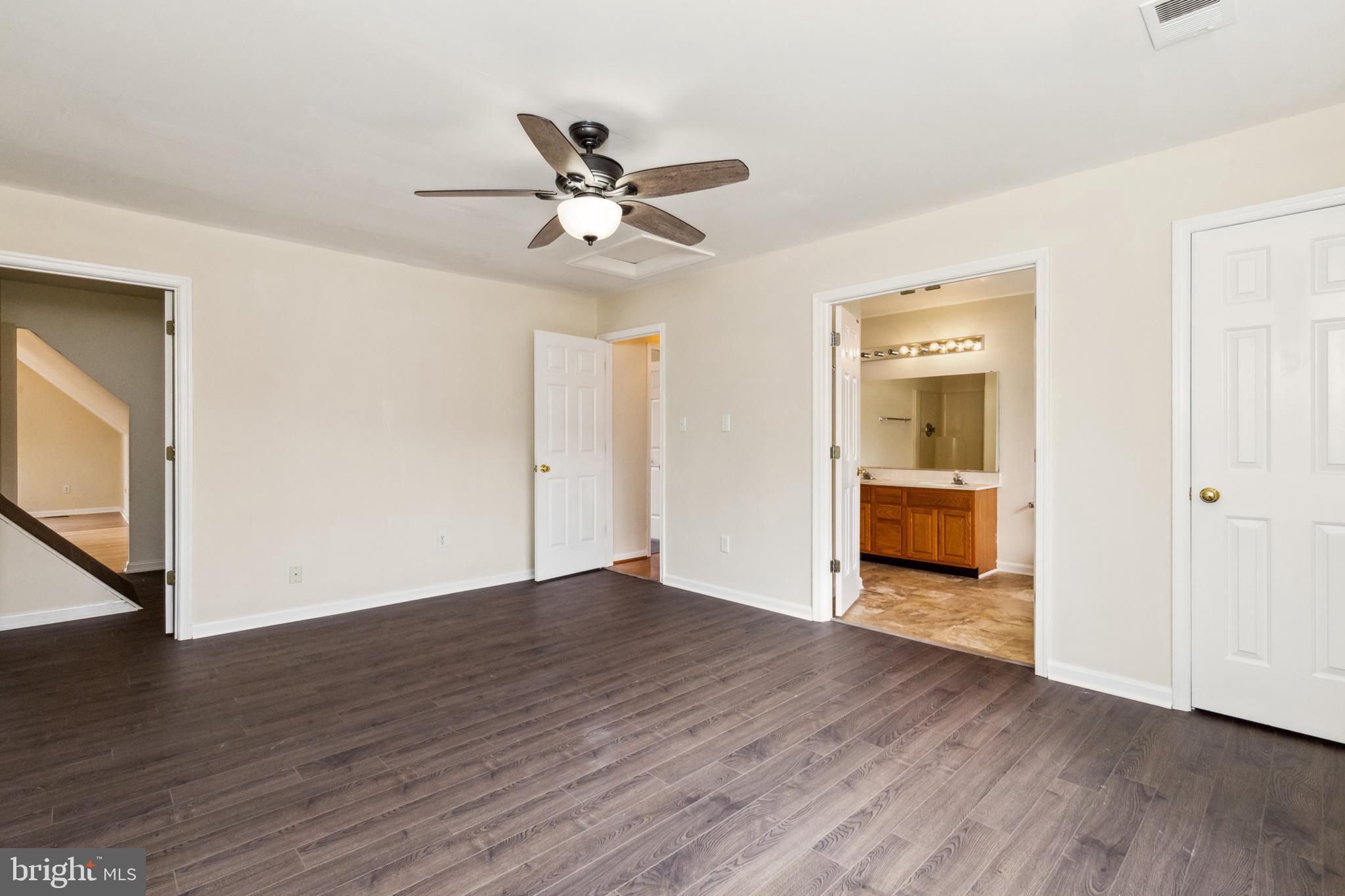 13157 Mt Paran Church Road Linden, VA 22642 - Photo 15 of 27 a view of a livingroom with wooden floor and a ceiling fan