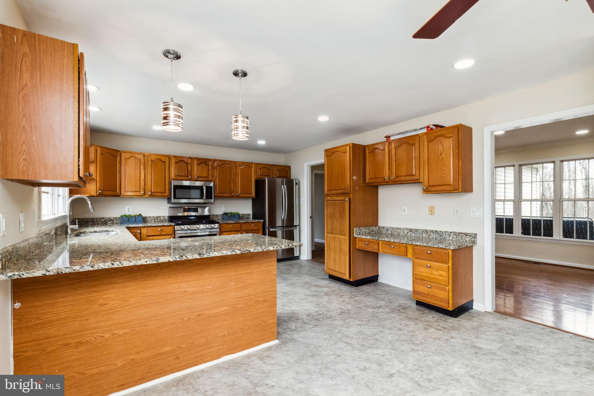 13157 Mt Paran Church Road Linden, VA 22642 - Photo 5 of 27 a kitchen with stainless steel appliances granite countertop a sink and a refrigerator