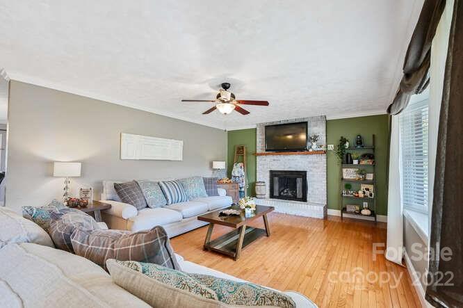 1423 Beaverdam Road Canton, NC 28716 - Photo 9 of 40 a living room with furniture and a fireplace