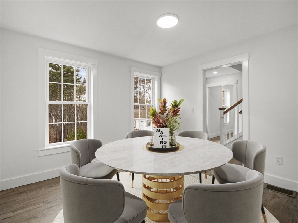 61 Arrow Groton, MA 01450 - Photo 7 of 42 a dining room with furniture and wooden floor