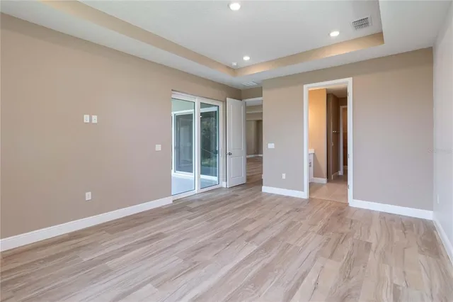 a bathroom with a shower and a door