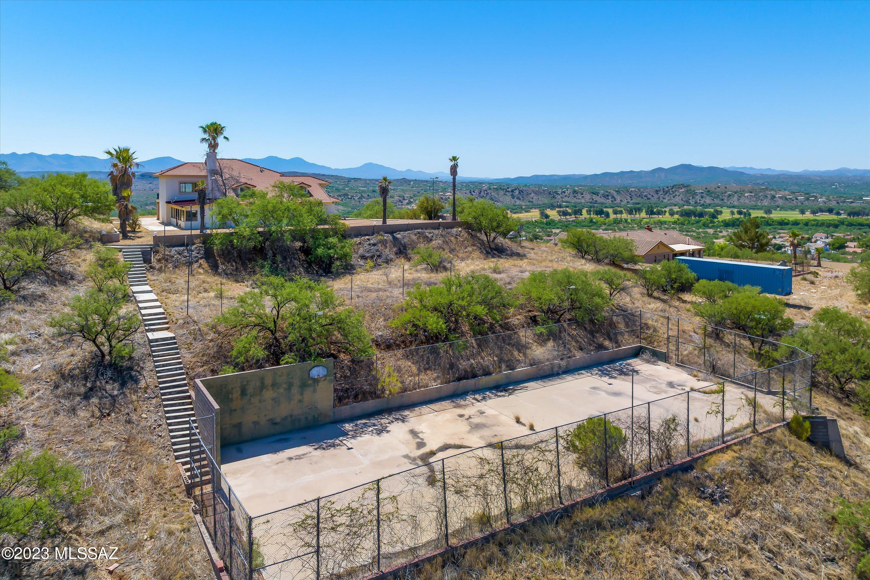 1226 Avenida Gloriosa Rio Rico, AZ 85648 - Photo 41 of 46 a view of a garden with an outdoor seating