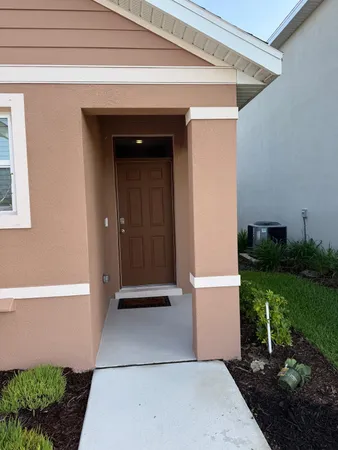 a kitchen with stainless steel appliances granite countertop a refrigerator a sink a stove a microwave and a refrigerator