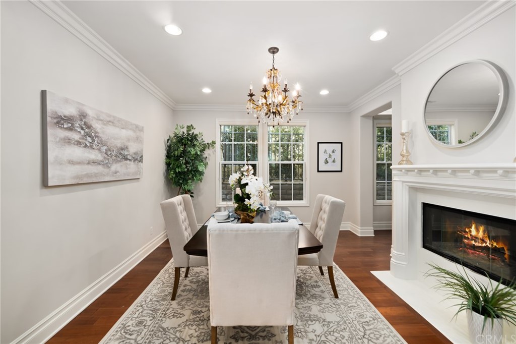 825 Cambridge Court Pasadena, CA 91107 - Photo 13 of 58 a living room with furniture a chandelier and a fireplace