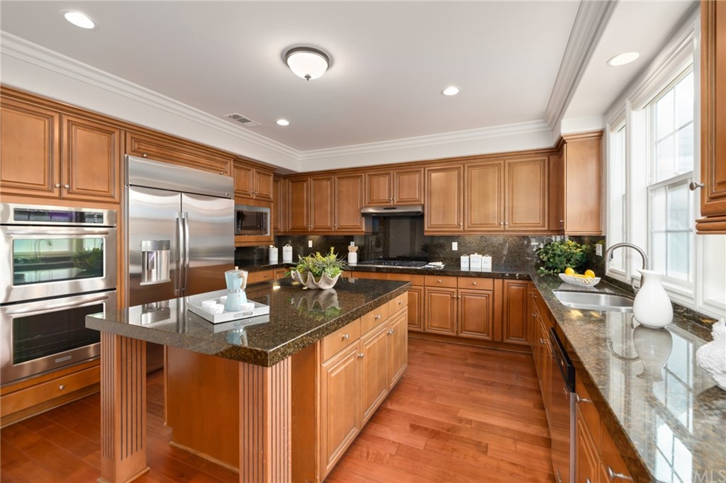 825 Cambridge Court Pasadena, CA 91107 - Photo 25 of 58 a large kitchen with stainless steel appliances granite countertop sink stove and refrigerator