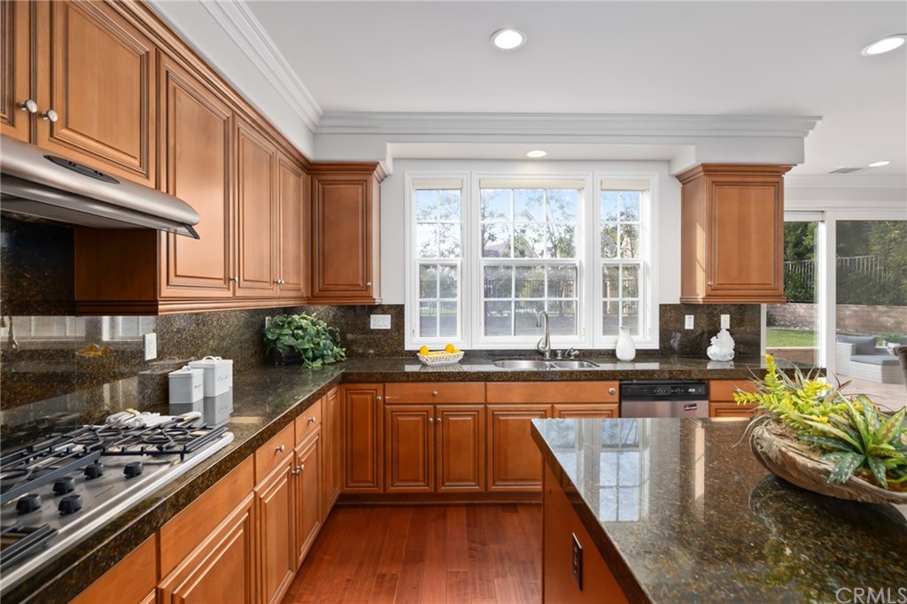 825 Cambridge Court Pasadena, CA 91107 - Photo 28 of 58 a kitchen with stainless steel appliances granite countertop a stove a sink and a microwave
