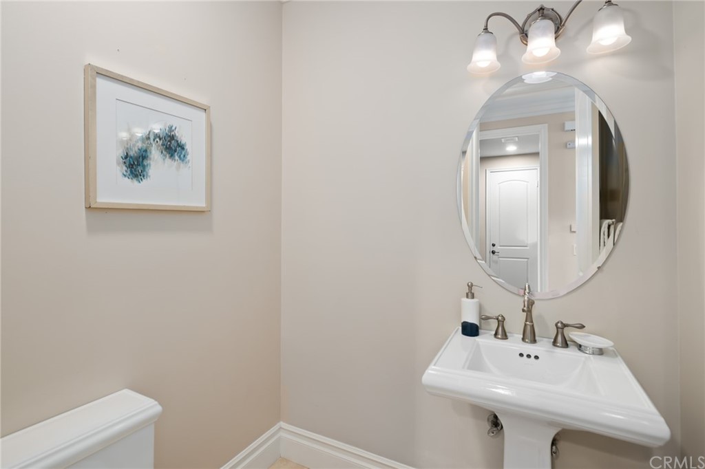 825 Cambridge Court Pasadena, CA 91107 - Photo 29 of 58 a bathroom with a sink mirror and vanity
