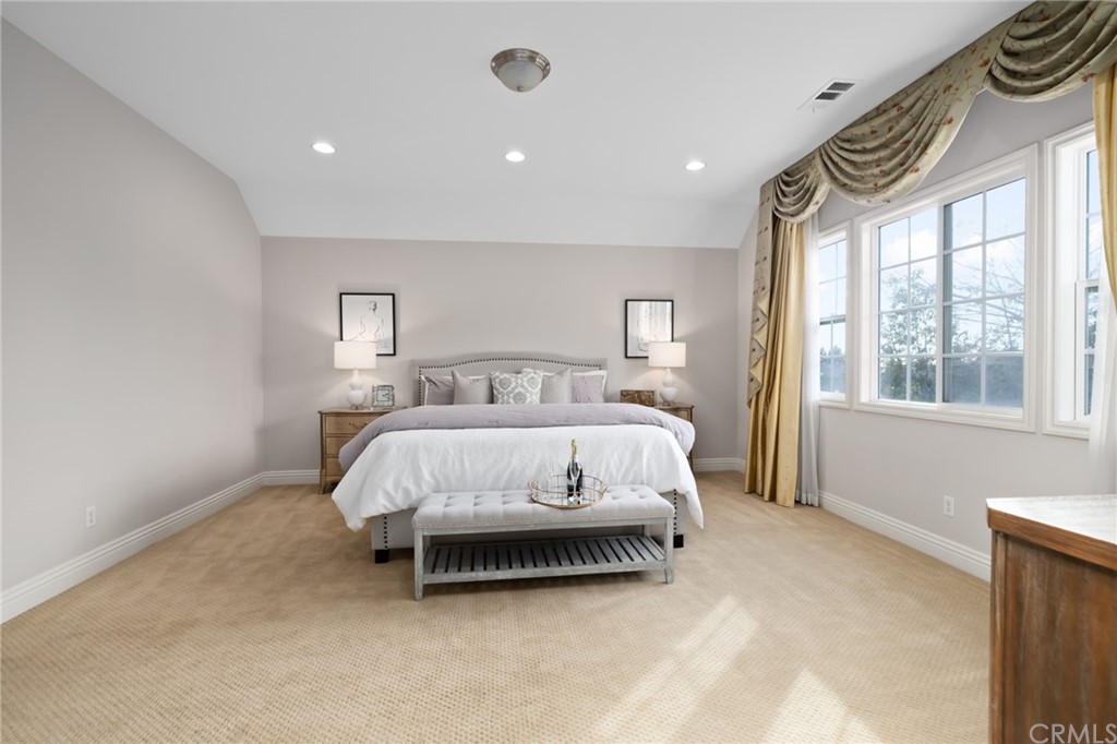 825 Cambridge Court Pasadena, CA 91107 - Photo 43 of 58 a bed sitting in a spacious bedroom next to a window