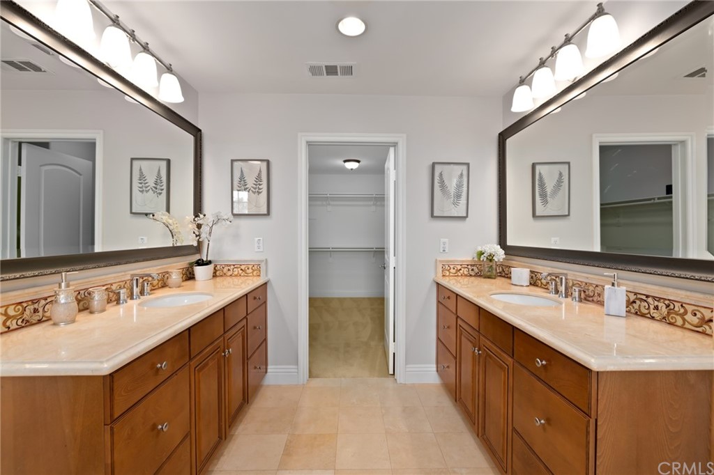 825 Cambridge Court Pasadena, CA 91107 - Photo 46 of 58 a bathroom with a sink double vanity and a mirror