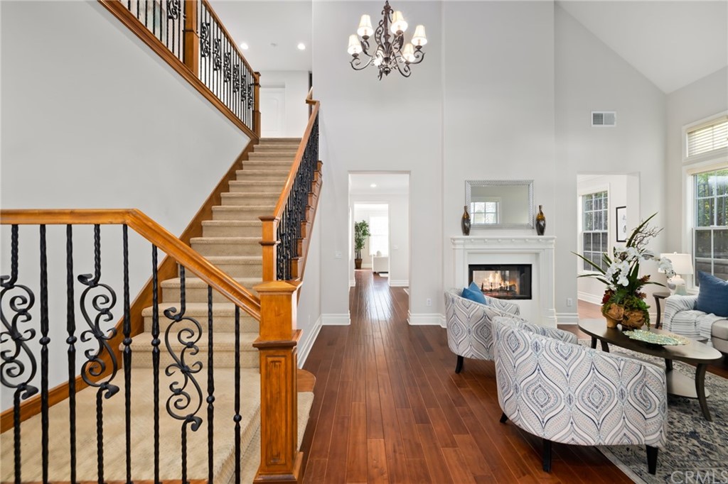 825 Cambridge Court Pasadena, CA 91107 - Photo 9 of 58 a living room with fireplace furniture and a wooden floor