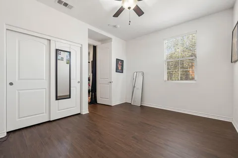 a bathroom with a double vanity sink toilet and a mirror