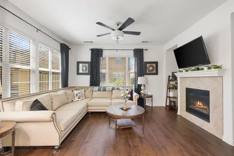 a living room with furniture fireplace and flat screen tv