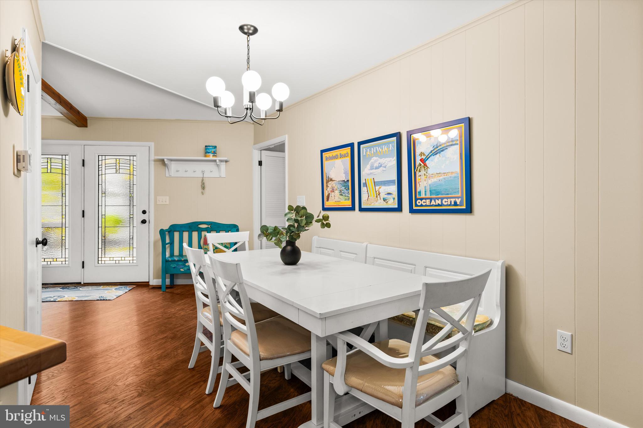 606 Spring Lake Court Bethany Beach, DE 19930 - Photo 11 of 53 a view of a dining room with furniture and wooden floor