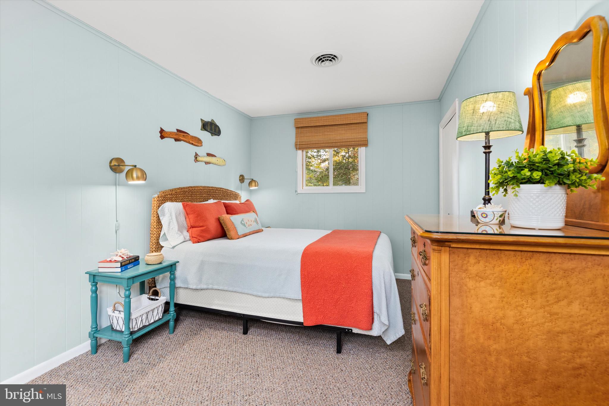 606 Spring Lake Court Bethany Beach, DE 19930 - Photo 23 of 53 a bedroom with a bed and window