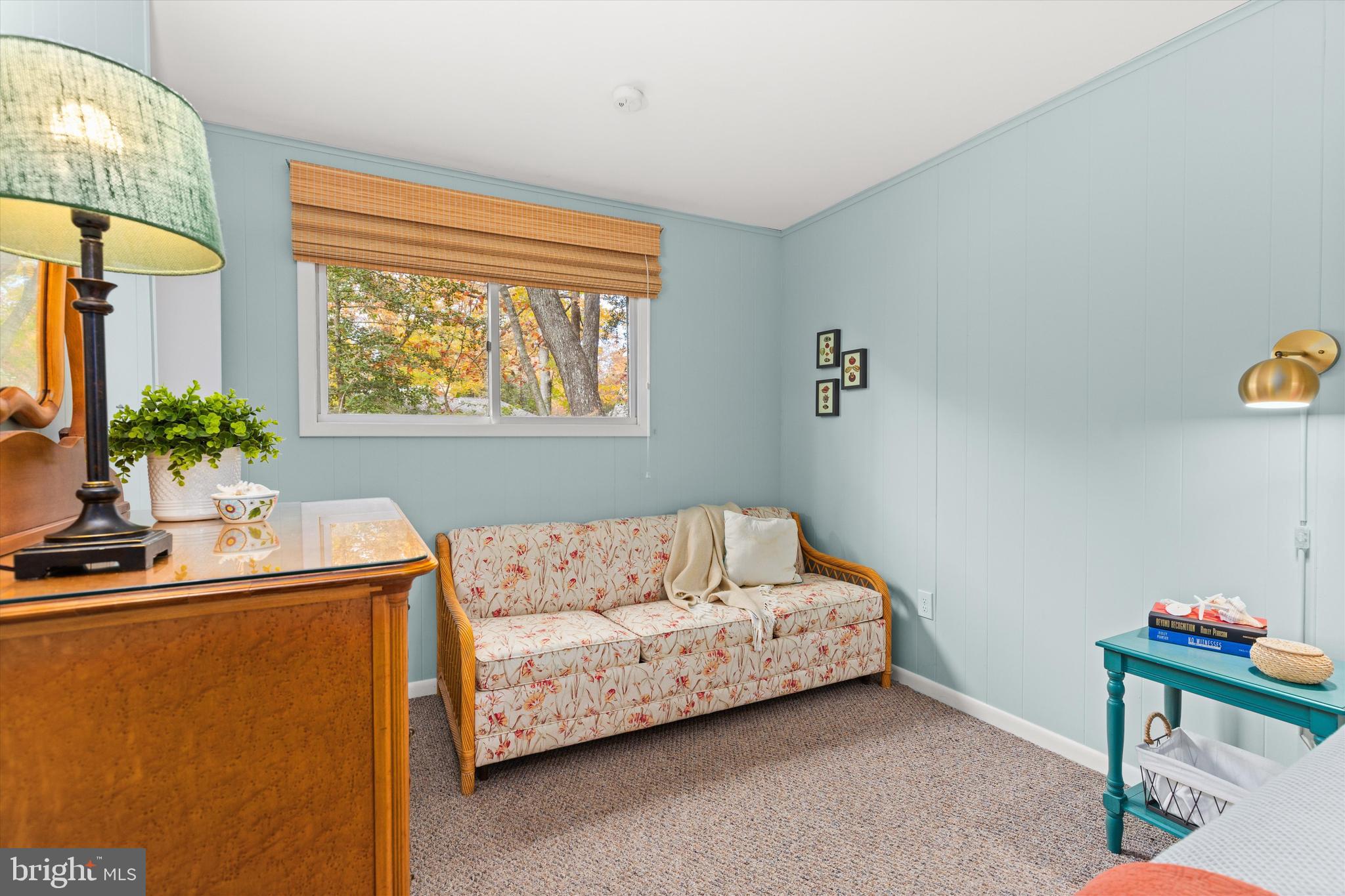 606 Spring Lake Court Bethany Beach, DE 19930 - Photo 25 of 53 a bedroom with a bed and a potted plant