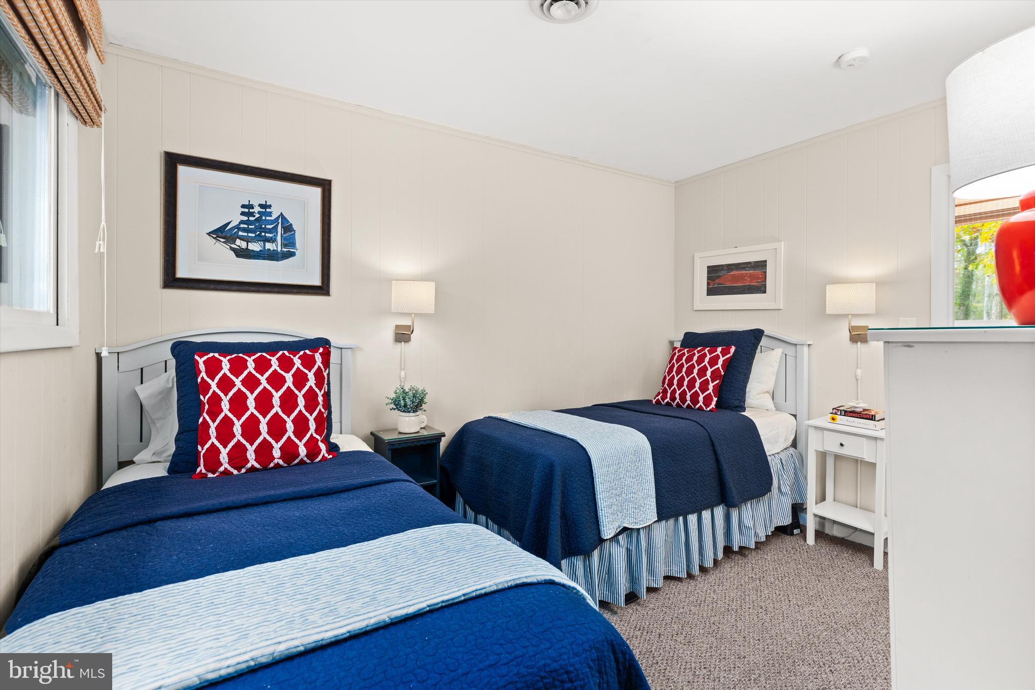 606 Spring Lake Court Bethany Beach, DE 19930 - Photo 28 of 53 a bedroom with a bed and a painting on the wall