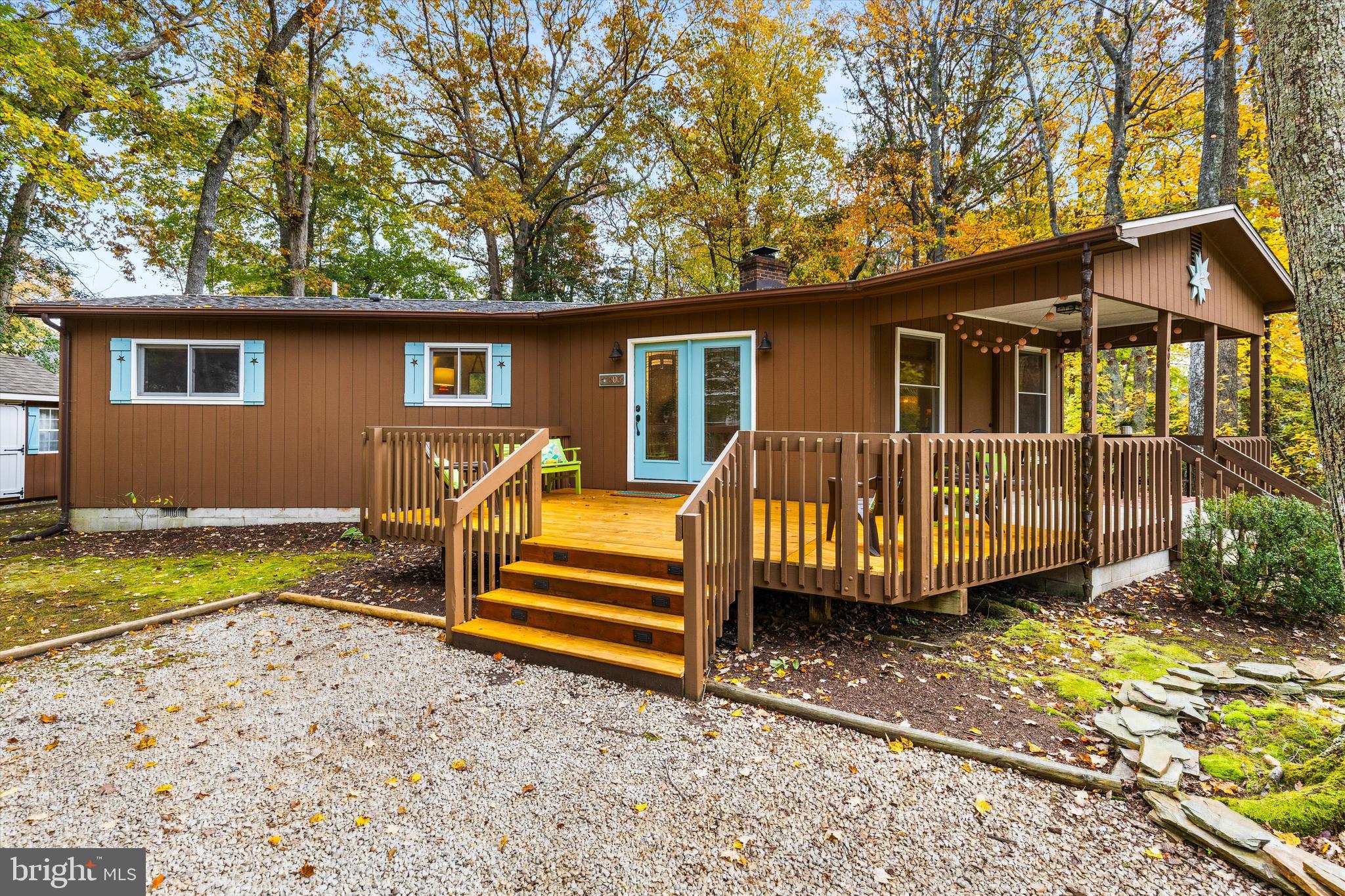 606 Spring Lake Court Bethany Beach, DE 19930 - Photo 4 of 53 a view of a house with a backyard and a tree