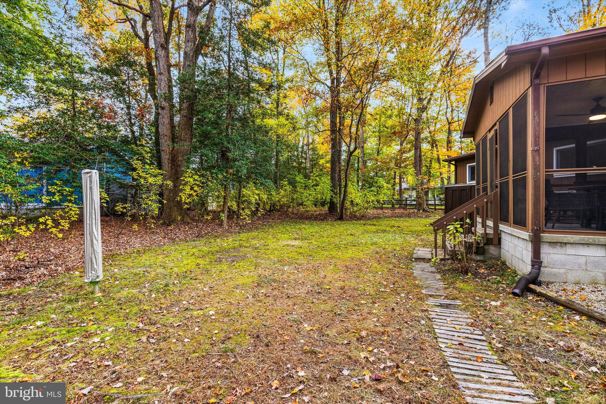 606 Spring Lake Court Bethany Beach, DE 19930 - Photo 43 of 53 a view of a yard with basketball court