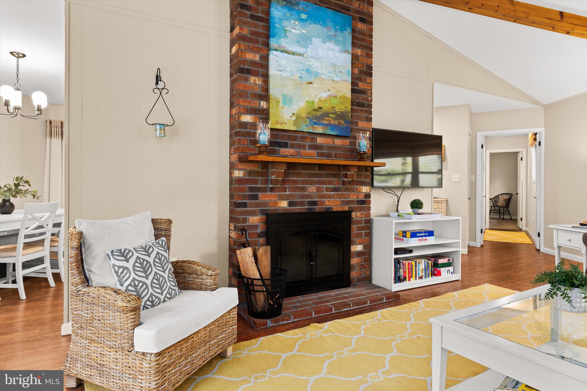 606 Spring Lake Court Bethany Beach, DE 19930 - Photo 8 of 53 a living room with furniture and a fireplace