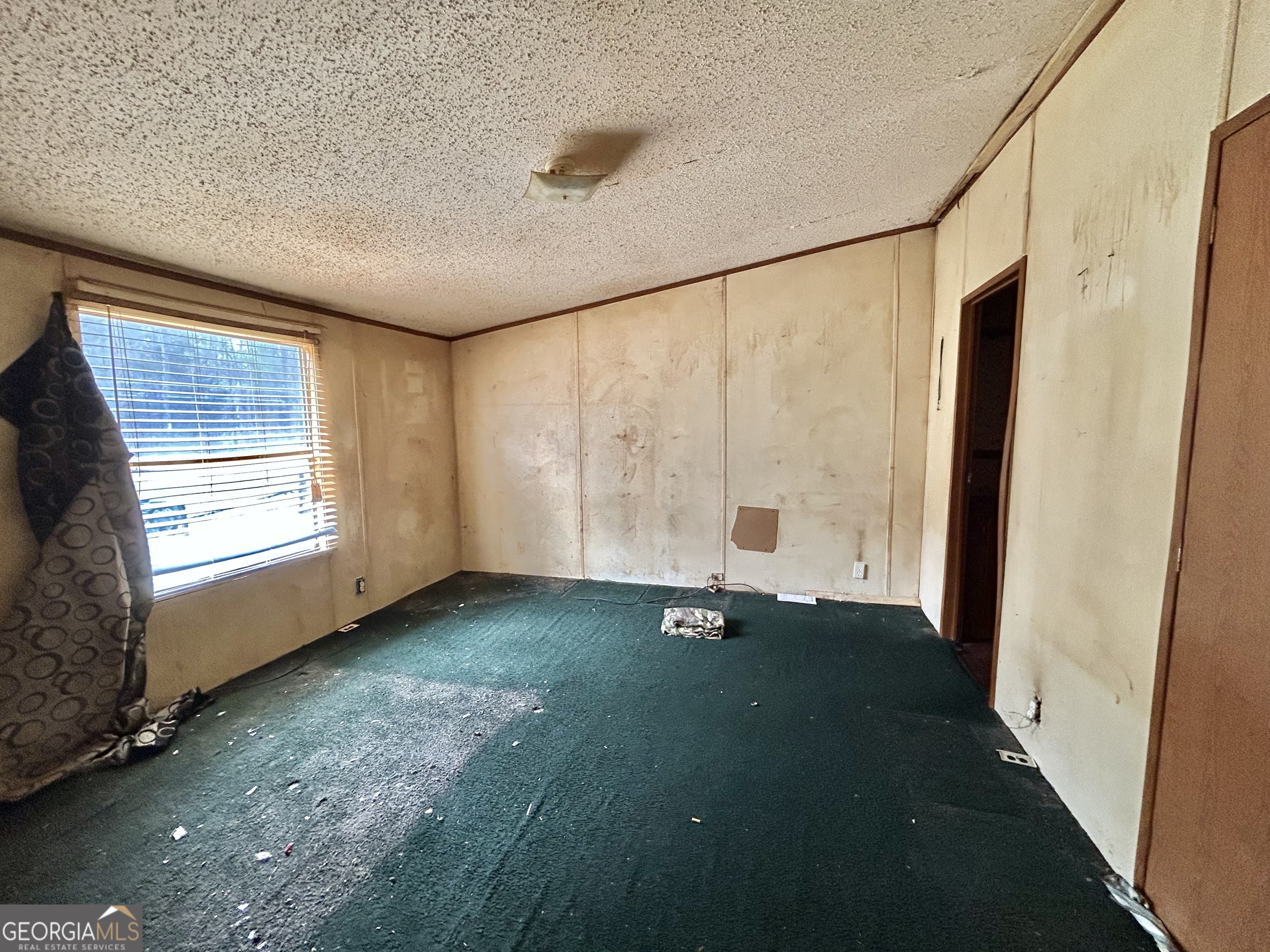 1299 Bodie Rayle Road Elberton, GA 30635 - Photo 11 of 18 a view of an empty room with a window