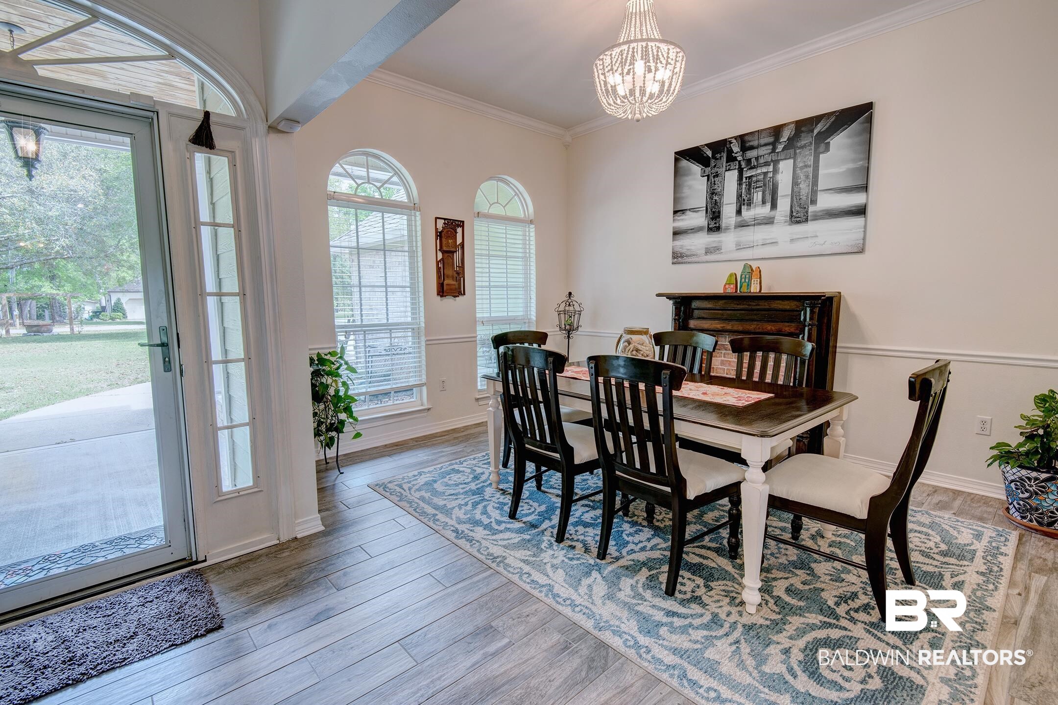 10093 Willis Road Foley, AL 36535 - Photo 4 of 33 Dining room featuring ornamental molding, light wood-type flooring, and hanging lights