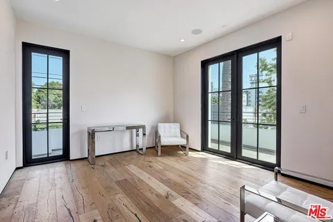 a bathroom with a double vanity sink toilet tub and shower