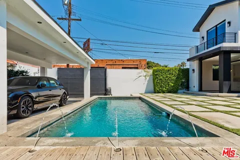 a aerial view of residential houses with outdoor space and street view